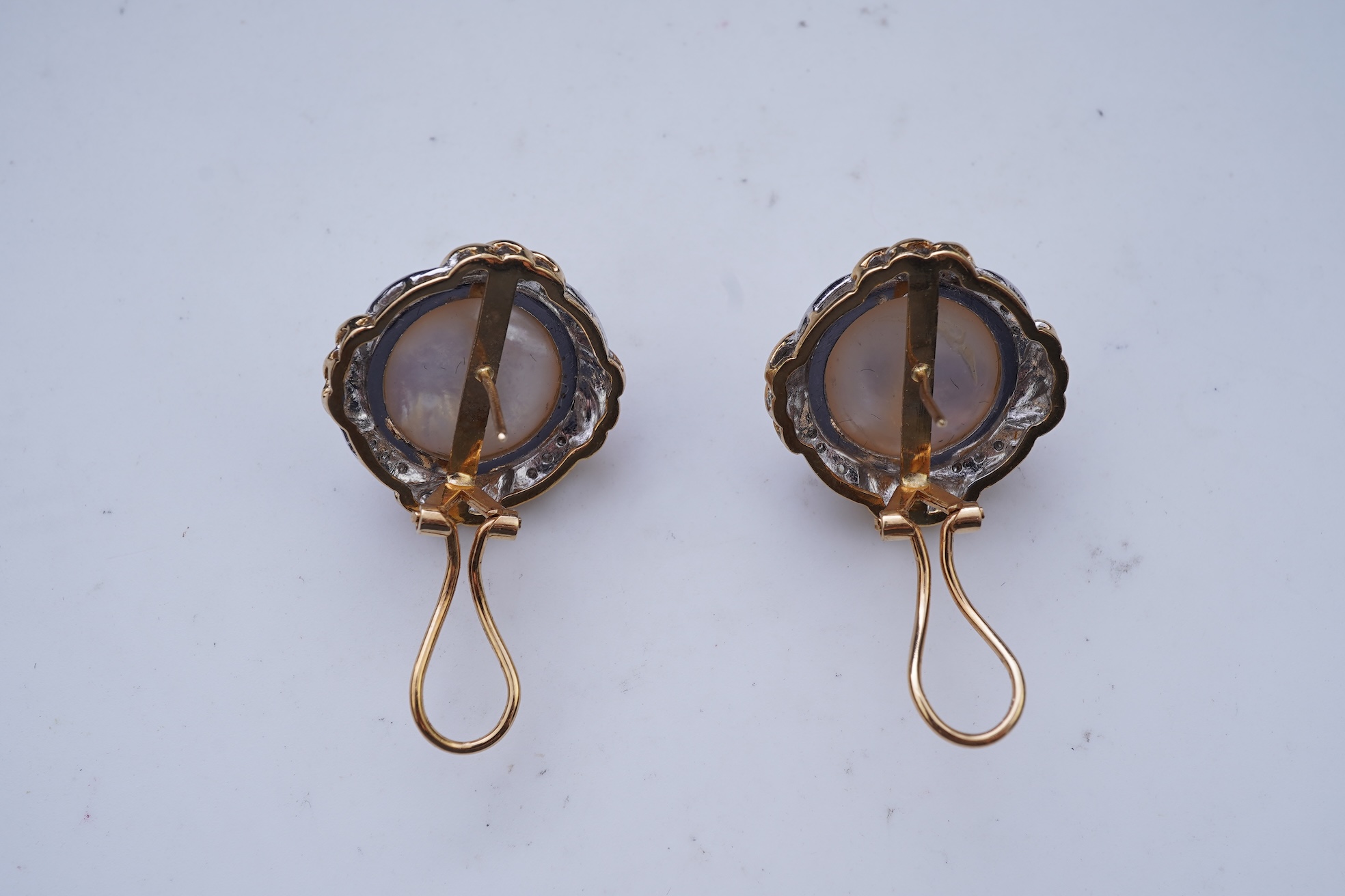 A pair of mabé cultured pearl and diamond earrings